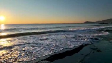 sea filmed on a drone in the sunset