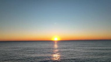 sea filmed on a drone in the sunset