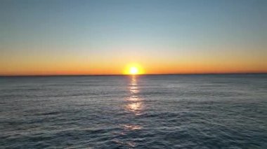 sea filmed on a drone in the sunset