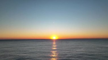 sea filmed on a drone in the sunset