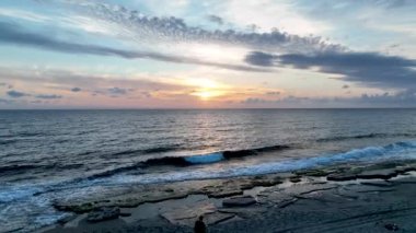Cloudy sunset at sea