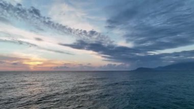 Cloudy sunset at sea