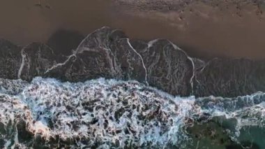 Sea waves on the beautiful beach aerial view drone 4k shot.