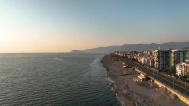 showing the Turkish coastal beach front and water park in the summer time on a hot sunny day