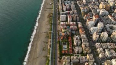 City panorama on the seashore 4K aerial view