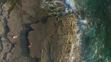 aerial view from drone at low altitude on sunset summer. Motion of small waves. Sea idyll. Relax 4 K