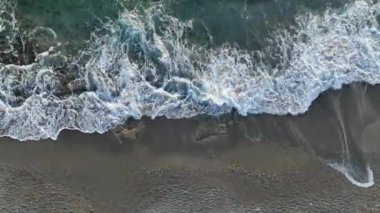 aerial view from drone at low altitude on sunset summer. Motion of small waves. Sea idyll. Relax 4 K