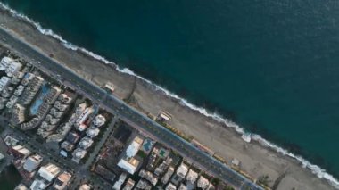 aerial view from drone at low altitude on sunset summer. Motion of small waves. Sea idyll. Relax 4 K