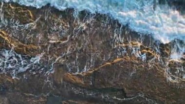 aerial view from drone at low altitude on sunset summer. Motion of small waves. Sea idyll. Relax 4 K