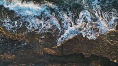 aerial view from drone at low altitude on sunset summer. Motion of small waves. Sea idyll. Relax 4 K