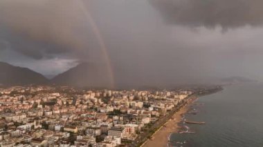 Double rainbow over the city during the rain aerial view, perfect quality 4K