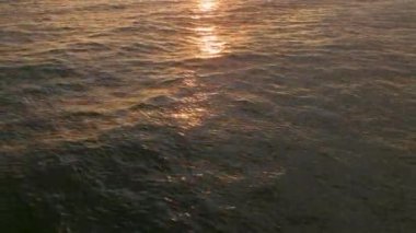 Strong rainbow above the city skyline over the houses and buildings in the daytime. The vivid phenomenon of nature. 4K