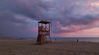 Rescue tower at sea great background in the pink sunset