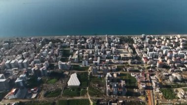 City panorama on the seashore 4K aerial view