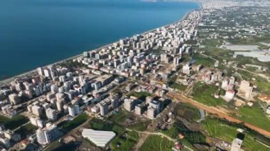 City panorama on the seashore 4K aerial view