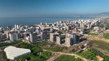 City panorama on the seashore 4K aerial view