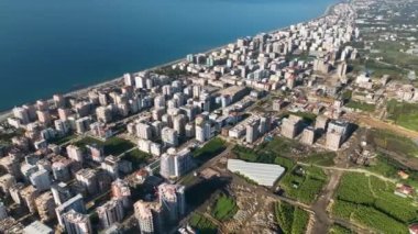 City panorama on the seashore 4K aerial view