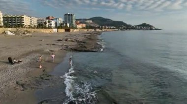 aerial view from drone at low altitude on sunset summer. Motion of small waves. Sea idyll. Relax 4 K
