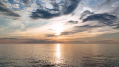 aerial view from drone at low altitude on sunset summer. Motion of small waves. Sea idyll. Relax 4 K