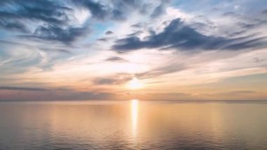 aerial view from drone at low altitude on sunset summer. Motion of small waves. Sea idyll. Relax 4 K