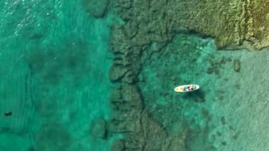 Sup surfing man swim in the sea