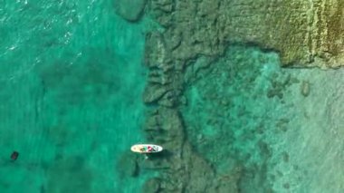 Sup surfing man swim in the sea