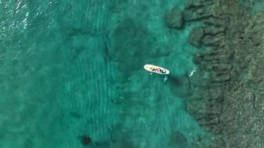 Sup surfing man swim in the sea