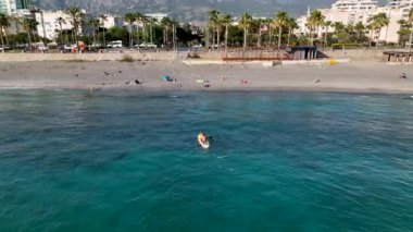 Sup surfing man swim in the sea