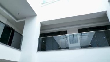 Aerial view in house with atrium space, building finishing work 4K