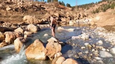 The guy enjoys the nature and breathes fresh air aerial view 4K