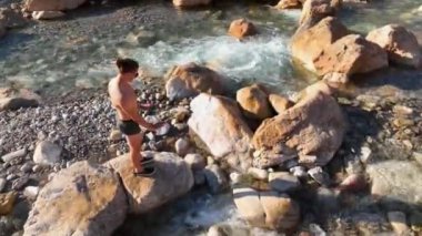 The guy enjoys the nature and breathes fresh air aerial view 4K