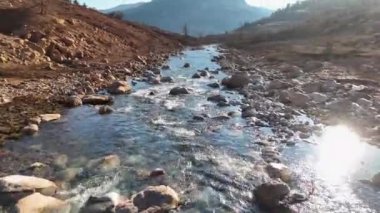 Cold water splashing near rapids. Concept of water background.