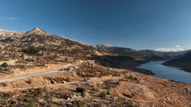 Smooth drone flight in the mountains, beautiful sunset light