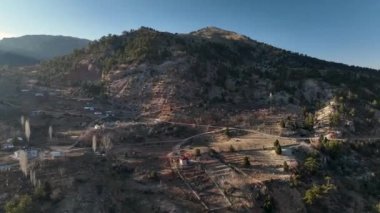 Smooth drone flight in the mountains, beautiful sunset light