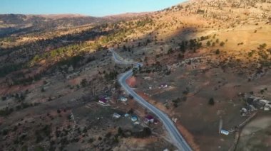 Beautiful landscape of a small village on the banks of a mountain river aerial view