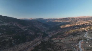 Beautiful landscape of a small village on the banks of a mountain river aerial view