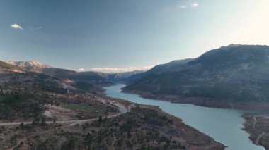 Beautiful landscape of a small village on the banks of a mountain river aerial view