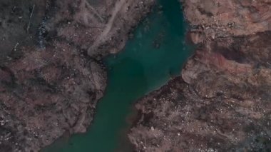 Beautiful landscape of a small village on the banks of a mountain river aerial view