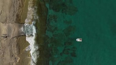 fishing near the shore in his small boat 4K