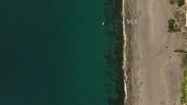 fishing near the shore in his small boat 4K