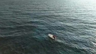 fishing near the shore in his small boat 4K