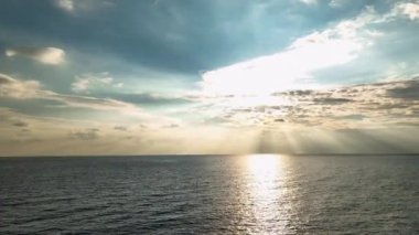 Beautiful sunset with colorful yellow and blue cloudy sky. fky above awesome sea