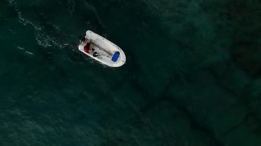 fishing near the shore in his small boat 4K