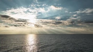 Beautiful sunset with colorful yellow and blue cloudy sky. fky above awesome sea