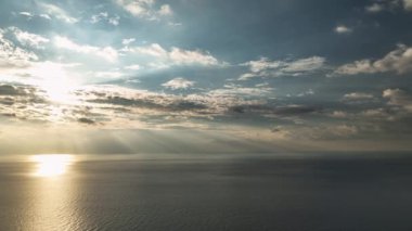 Beautiful sunset with colorful yellow and blue cloudy sky. fky above awesome sea