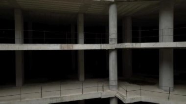 Old unfinished mall, empty space, bare concrete, aerial view. 4K aerial view