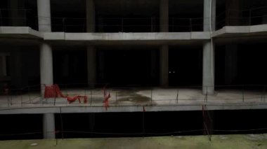 Old unfinished mall, empty space, bare concrete, aerial view. 4K aerial view