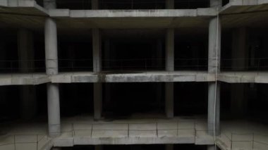 Old unfinished mall, empty space, bare concrete, aerial view. 4K aerial view