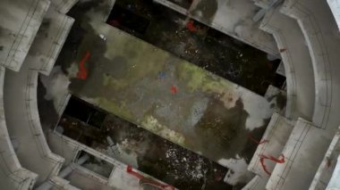 Old unfinished mall, empty space, bare concrete, aerial view. 4K aerial view