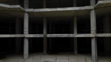 Old unfinished mall, empty space, bare concrete, aerial view. 4K aerial view
